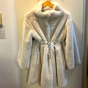 White faux fur coat